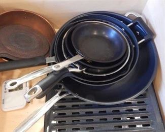 Drawrs full of pots and pans.