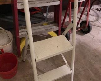Several small metal ladders