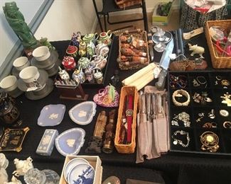 Pewter tea cup holders, silver plated knife sets, collectible enamel tea pots, German carved figural cork stoppers, carved Asian pieces 