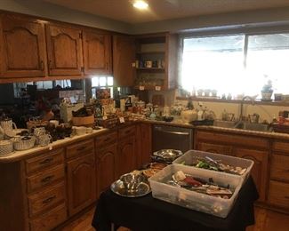 Full kitchen with small appliances, utensils, serving pieces, wood bowls