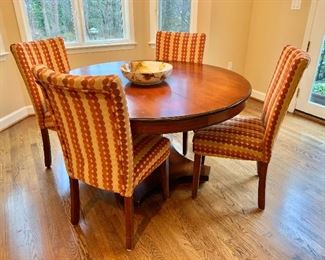 Pottery Barn round pedestal table (plus leaf) and four custom upholstered parsons chairs