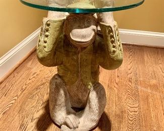Occasional glass top table with Monkey base