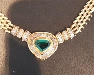 14 KT gold necklace with heart shaped emerald with diamond baguettes. 