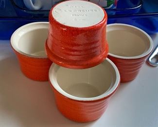 4 Orange LeCreuset bowls