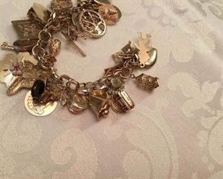 14kt yellow gold charm bracelet - 90 grams