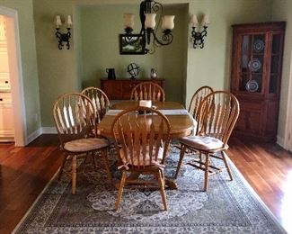 Birch dining table with two leafs, six arrow back chairs,   Classic Huntboard and Glass Front Corner Cabinet, 9x12 Royal Kingdom rug