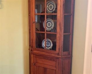 Made  by Southern Craftsmen Guild, Mt Airy , Georgia. "Glass Front Corner Cabinet"