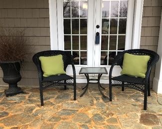 Two outdoor chairs, small glass top table, urn
