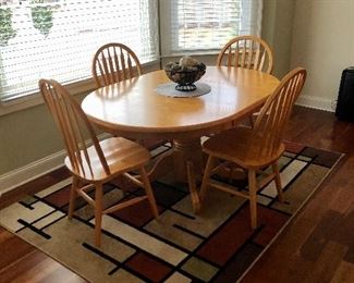 Oval table with four matching chairs, Orian rug  5 x 7