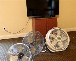 fan collection, TV and small locking cabinet