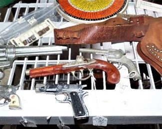 Toy guns : Left to Right : Nichols Stallion 38, Nichols Pinto, Hubley Colt, Hubley Flintlock Jr., Kilgore Pal, Roy Rogers toy gun holster