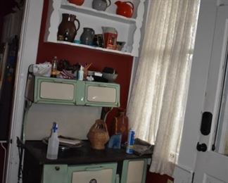 I just wanted you to see what is sitting in the shelving above this wonderful Rebbecca Washington Cast Iron Cook Stove Fiesta, Hull, and other Potteries throughout the house! 