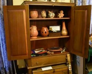 The chest is filled with Pottery and Southwest items as well as Beautiful Kachina Dolls and Southwest Painting on Wall behind the Kachinas