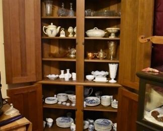 Many Items inside the Double Doors of this Cupboard