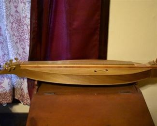 Hand made by Dr. George Richard Buchanan, who also published a book on the making of fine dulcimers, This is a fine example of his work, a Tear Drop Dulcimer made of poplar.
