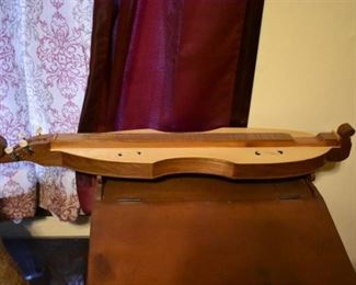 Hand made by Dr. George Richard Buchanan, who also published a book on the making of fine dulcimers, This is a fine example of his work, a Fiddle Dulcimer made of Walnut and Copper.