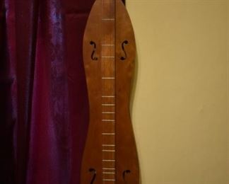 Hand made by Dr. George Richard Buchanan, who also published a book on the making of fine dulcimers, This is a fine example of his work, an Hour Glass  Dulcimer made of poplar.