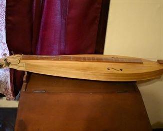 Hand made by Dr. George Richard Buchanan, who also published a book on the making of fine dulcimers, This is a fine example of his work, a Tear Drop  Dulcimer made of poplar.