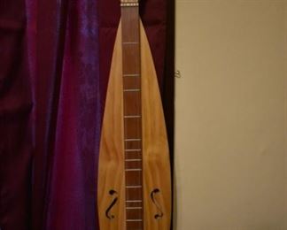 Hand made by Dr. George Richard Buchanan, who also published a book on the making of fine dulcimers, This is a fine example of his work, a Tear Drop  Dulcimer made of poplar.