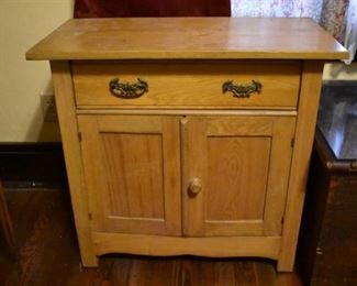 antique Oak Cabinet features pull out drawer and double door cabinet