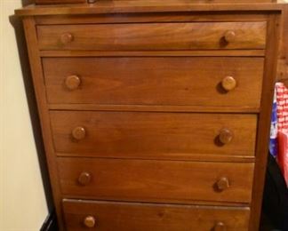 antique Walnut Dresser complete with a Matching Spindle Bed in the Basement and a Mirrored Dresser upstairs. Notice also the  Antique Clock on top of the Dresser.