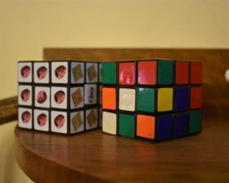 Original Rubiks Cube and an Advertising "Corn Cheks" Rubik Cube