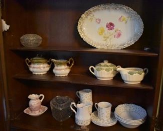 Lots of Collectible Porcelains in Antique Cupboard