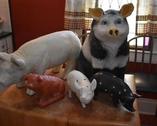 A close up of the antique/vintage chalkware Pigs large and medium-size