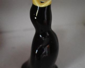 This is an Antique Pie Bird it was put into the middle of a pie just before baking its purpose was to let off steam and keep the pie from running over. It whistles when the pie is done.