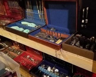 2 Shelves Full of Antique and Vintage Silverware Sets The Basement is Full of Everything you can imagine from antique and vintage Glassware, Silver, Pottery, Primitives Tools, Records, Silverware, Pie Safe, Antique Tool Chests and Wooden Trunks, Primitive Tools, Antique Looms and So Much, Much More!