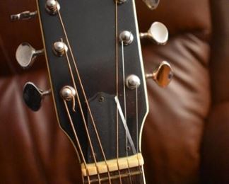 Vintage Fame Acoustic-Electric Guitar 747 Chet Atkins MIJ Japan 1970's w/Hard Shell Dean Case!
designed by Chet Atkins for the program, Famous American Musicians & Educators, as a 747 model made in Japan in the 1970s.  "Natural finish, rosewood back & sides, spruce top, bound mahogany neck with rosewood fingerboard & pearl dot inlays, individual chrome tuners, adjustable rosewood bridge, black pickguard, factory soundhole pickup with Volume & Tone controls." This Guitar is like "Show Room New!"