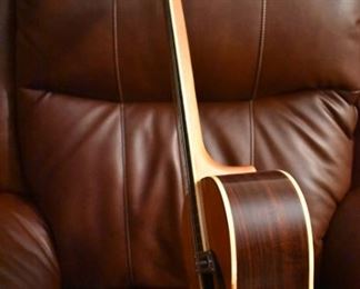 Vintage Fame Acoustic-Electric Guitar 747 Chet Atkins MIJ Japan 1970's w/Hard Shell Dean Case!
designed by Chet Atkins for the program, Famous American Musicians & Educators, as a 747 model made in Japan in the 1970s.  "Natural finish, rosewood back & sides, spruce top, bound mahogany neck with rosewood fingerboard & pearl dot inlays, individual chrome tuners, adjustable rosewood bridge, black pickguard, factory soundhole pickup with Volume & Tone controls." This Guitar is like "Show Room New!"