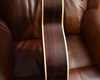 Vintage Fame Acoustic-Electric Guitar 747 Chet Atkins MIJ Japan 1970's w/Hard Shell Dean Case!
designed by Chet Atkins for the program, Famous American Musicians & Educators, as a 747 model made in Japan in the 1970s.  "Natural finish, rosewood back & sides, spruce top, bound mahogany neck with rosewood fingerboard & pearl dot inlays, individual chrome tuners, adjustable rosewood bridge, black pickguard, factory soundhole pickup with Volume & Tone controls." This Guitar is like "Show Room New!"