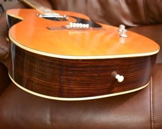 Vintage Fame Acoustic-Electric Guitar 747 Chet Atkins MIJ Japan 1970's w/Hard Shell Dean Case!
designed by Chet Atkins for the program, Famous American Musicians & Educators, as a 747 model made in Japan in the 1970s.  "Natural finish, rosewood back & sides, spruce top, bound mahogany neck with rosewood fingerboard & pearl dot inlays, individual chrome tuners, adjustable rosewood bridge, black pickguard, factory soundhole pickup with Volume & Tone controls." This Guitar is like "Show Room New!"