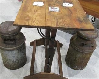 Vintage drafting table with early milk can seats