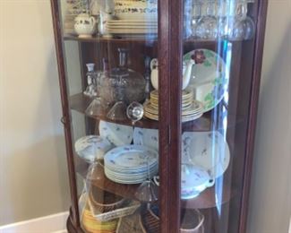 Round solid wood cheery glass china cabinet  with china and crystal inside that is or sale as well. 
