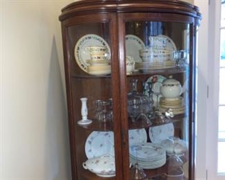 Beautiful china, crystal, silver and silver plated items and vintage hurricane lanterns.  Solid wood and beveled glass cabinet 