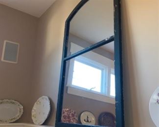 Oval and square black framed mirror 