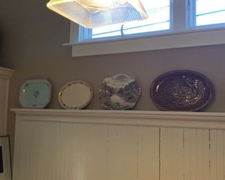Pottery plates and silver plated plates. 