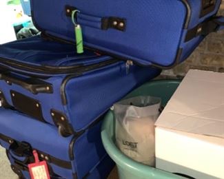 set of blue luggage 