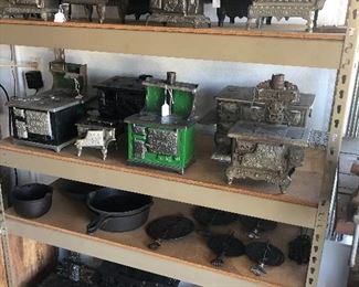 Huge collection of miniature cast iron stoves