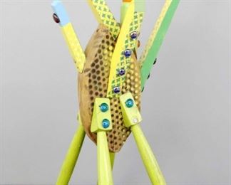 "Chair Master" Sculpture. Mixed media sculpture entitled "Chair Master". Multi-color painted wooden body with applied beads, cabochons and enamel. Partial signature, marked “R01". Minor surface wear, ½ " hole drilled in underside for display mounting. Measures 13" x 27" high. Reference #K.53  