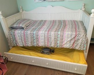 White twin trundle daybed. Top mattress is a thick memory foam. Bottom mattress is a Sleep number!