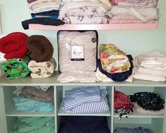 Linens. (green cabinet and pink shelves are not for sale)