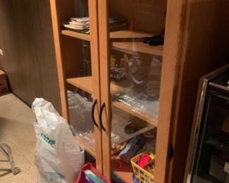 Wooden and glass cabinet can house anything from Books to China to clothing