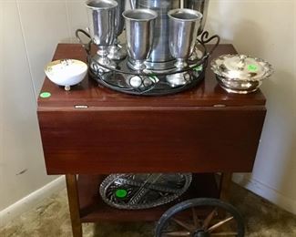 The mahogany tea cart with leaf down and the pewter wine glasses on tray.