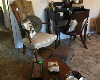 A wonderful cane back chair with cream color stripe fabric,with small stool, newly upholstered in leather like fabric with tassels.  Another small mahogany desk with lift down top.  Has mahogany chair with needle point fabric.