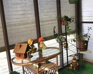 Just a few of the bird houses and plants on sunroom.