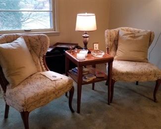 Pair of matching slipper chairs, pillows are feather/down stuffed, interesting square side table with 2nd shelf, small table lamp, crystal coasters, large cigar ashtray, 2 sets of stone coasters, several small books
