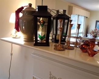 Small brass lamp, ceramic lidded jar, beaded tassel, metal stained-glass candle lantern, 3 brass candlesticks, matching pair of amber glass birds